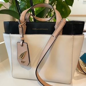 Leather handbag with removable crossbody strap.